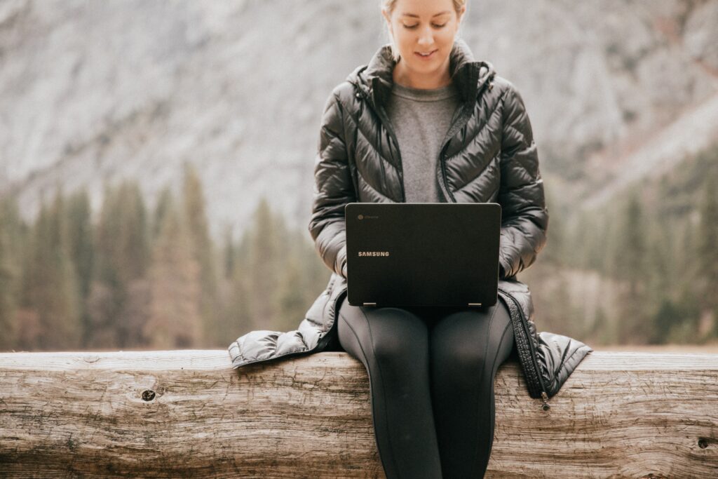 woman Getting wifi while camping
