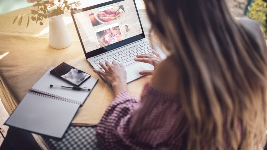 Woman using computer at home