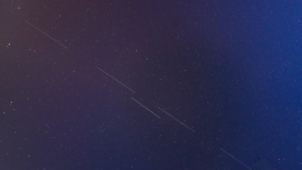 Starlink satellites in night sky