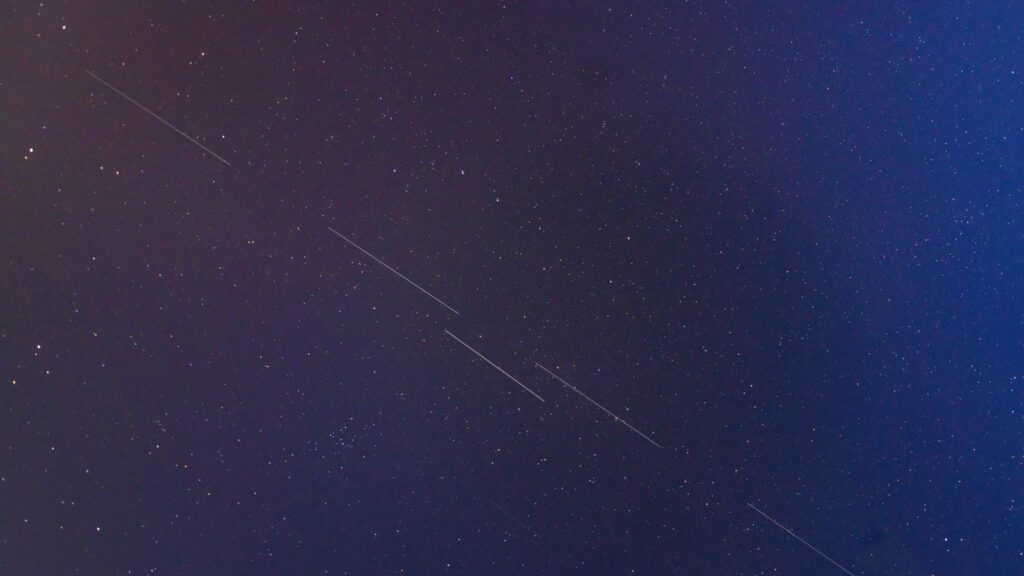 Starlink satellites in night sky