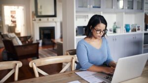 woman using laptop at home