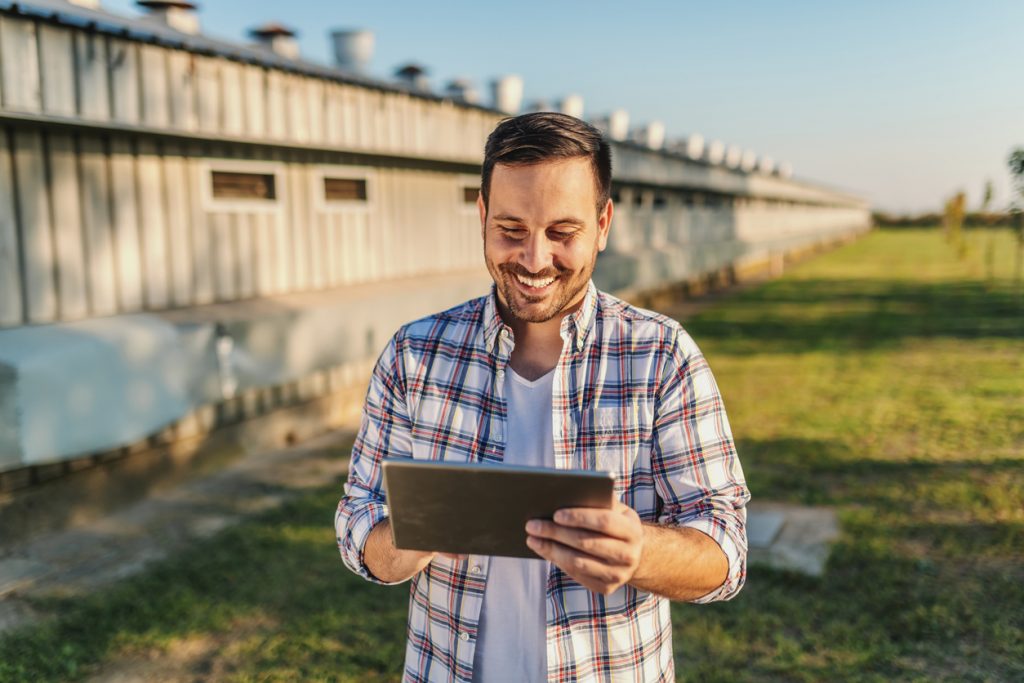 Man using technology in rural setting