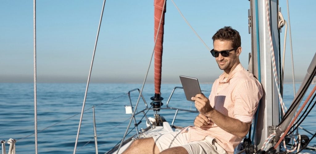 person using internet on boat