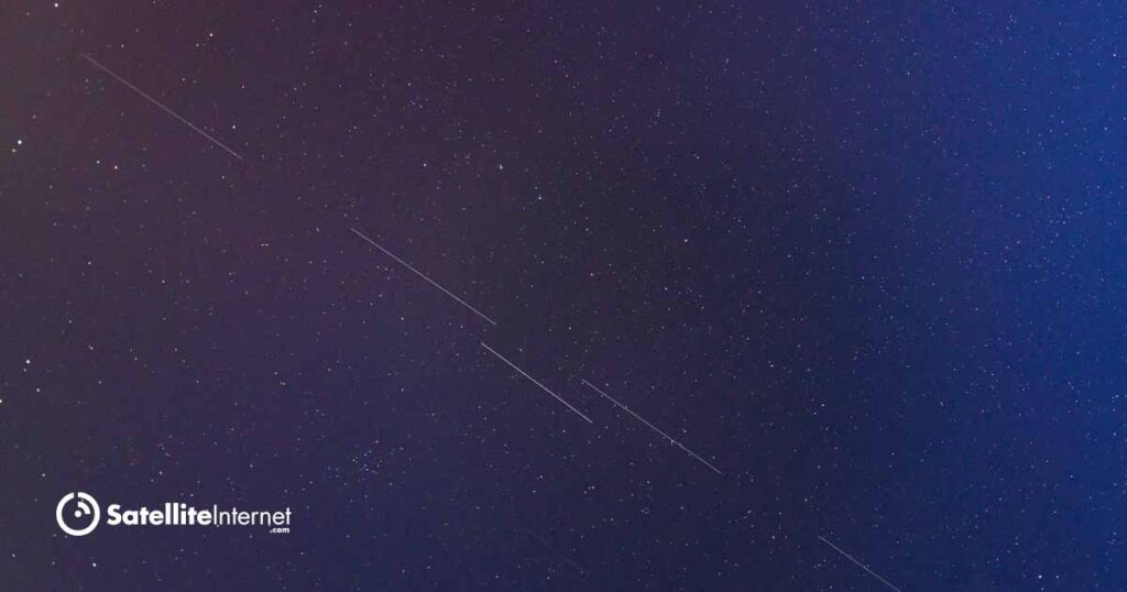 starlink satellite moving across starry sky